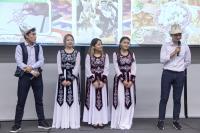 A group of Kyrgyz students promoting the Kyrgyz Cultural Night at a communal dinner